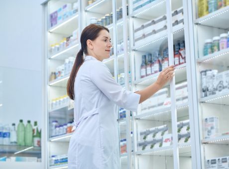 Pharmacist checking medicines in a drugstore